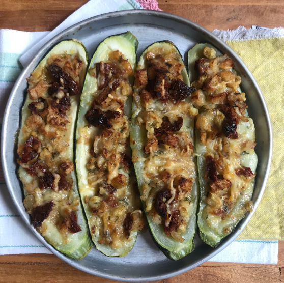 OVEN BAKED ZUCCHINI STUFFED WITH WHITE ONION, SUN-DRIED TOMATOES, CACIO CAVALLO CHEESE AND BREAD CRUMBS (X2)